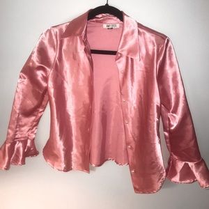 pink silk top with flared sleeve and pearl buttons